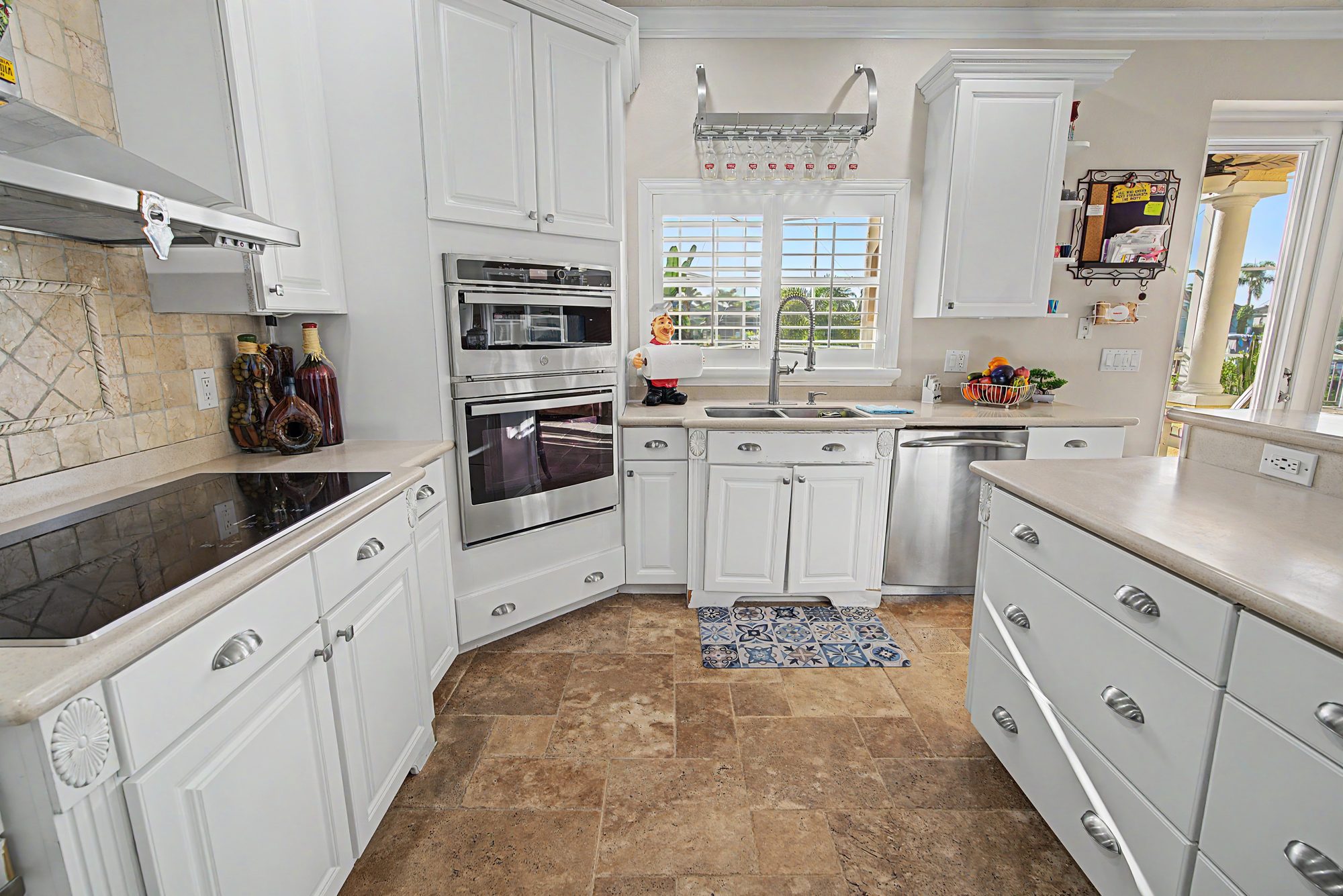 White kitchen with double wall ovens