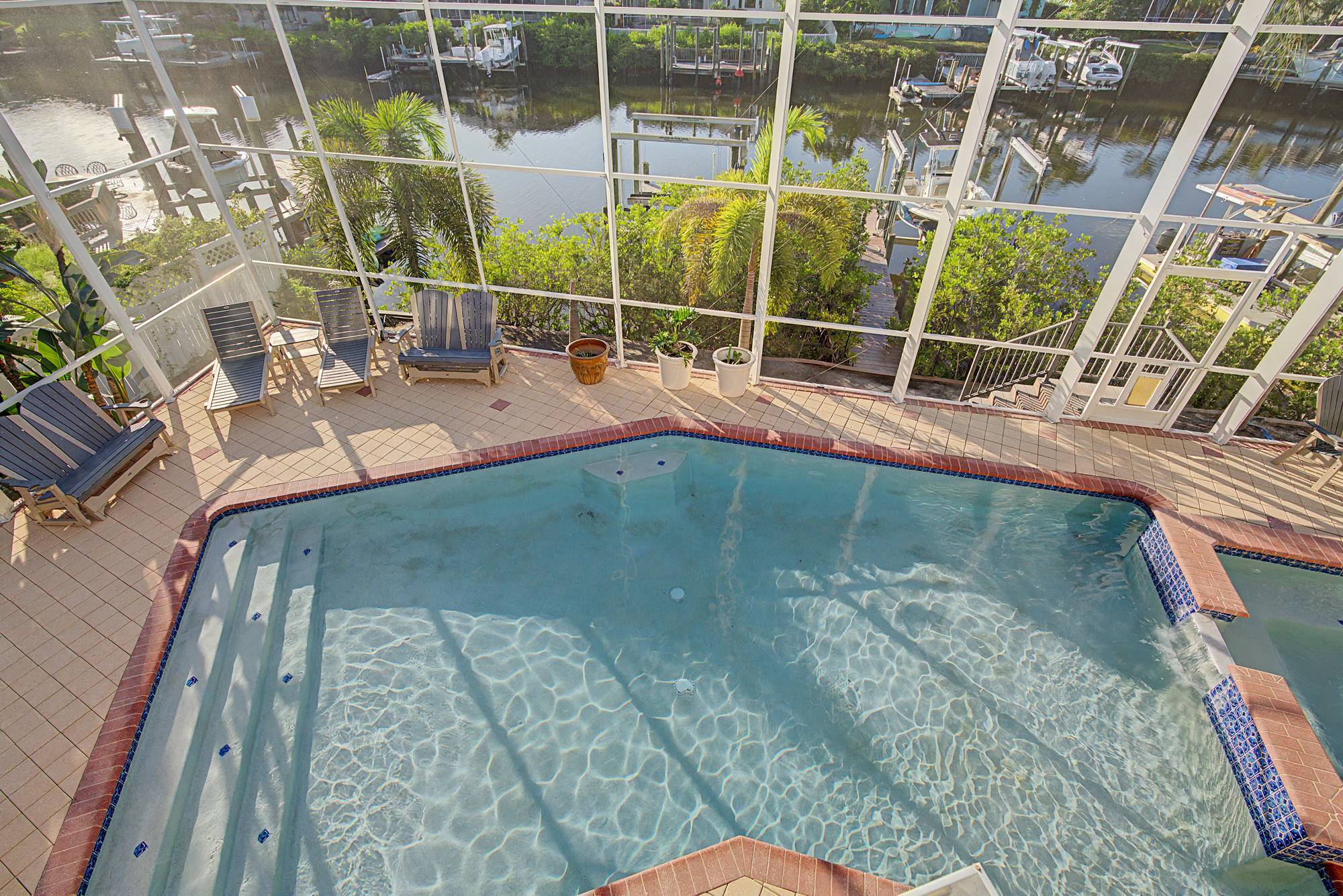 Screened pool with a view of the canal